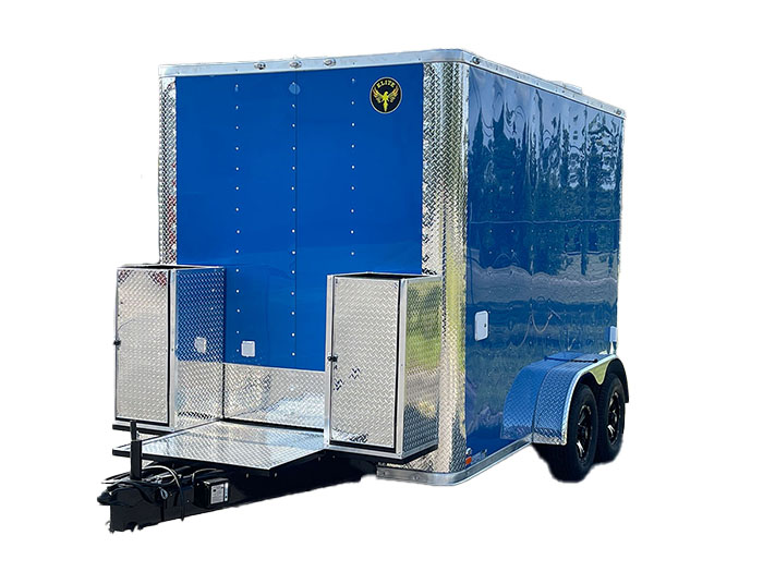 The image shows a large, blue enclosed trailer with a silver metal exterior, parked on an unseen surface.
