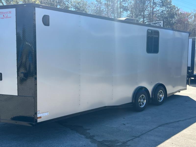 The image shows a large, enclosed trailer parked outdoors during daylight hours.
